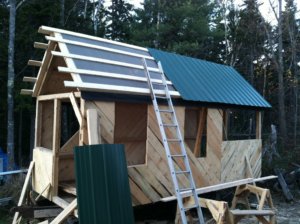 "roofing going on" by Stone Soup Institute, Harpswell, Maine is licensed under CC BY 2.0