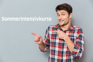 Portrait Of A Casual Man Pointing Fingers Away