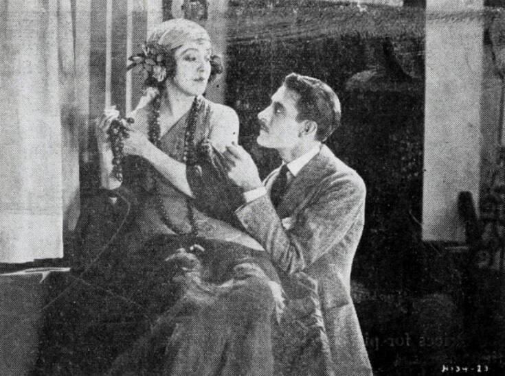 Still from the American drama film While Paris Sleeps (1923), on page 1 of the February 19, 1923 Film Daily.